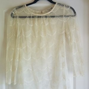 Cream colored, long sleeve, lace top.
